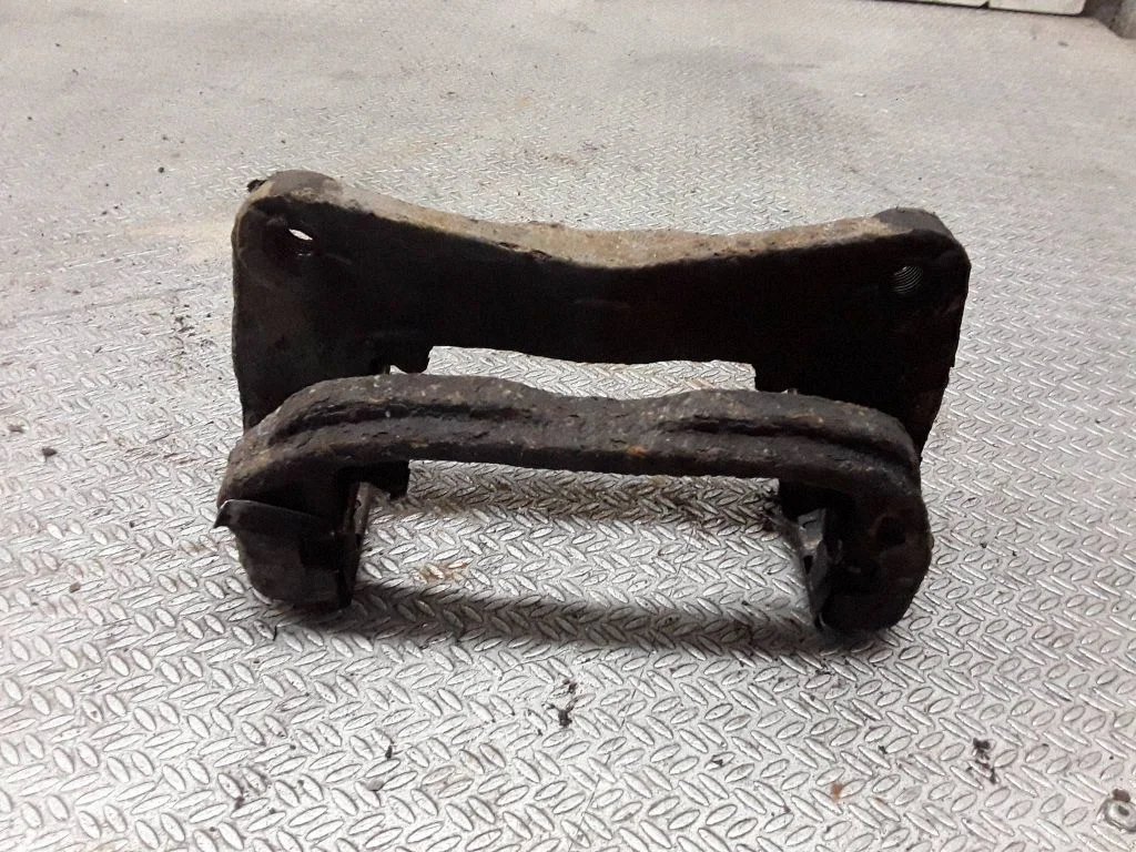 Front Brake Caliper Pad/Carrier – left