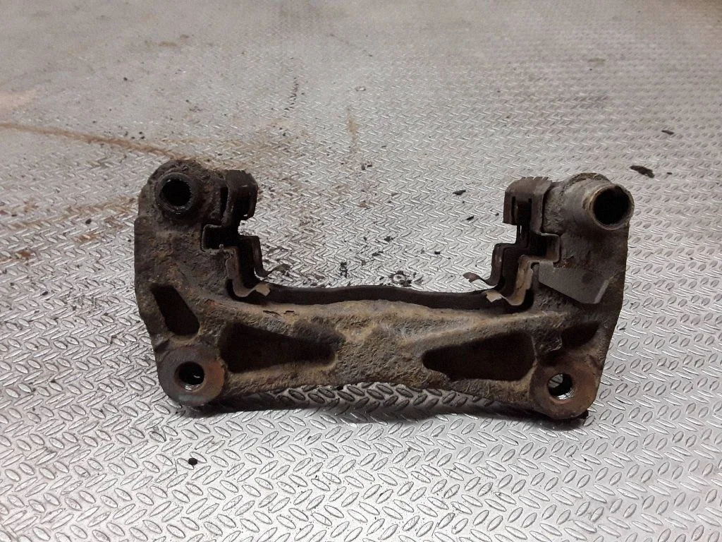 Front Brake Caliper Pad/Carrier – right