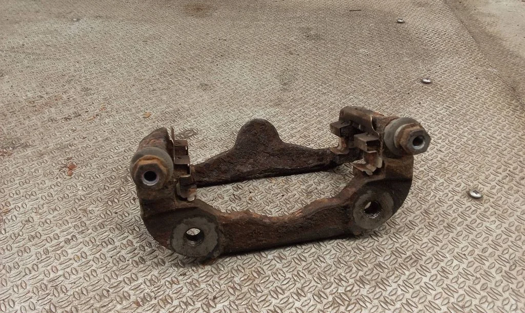 Front Brake Caliper Pad/Carrier