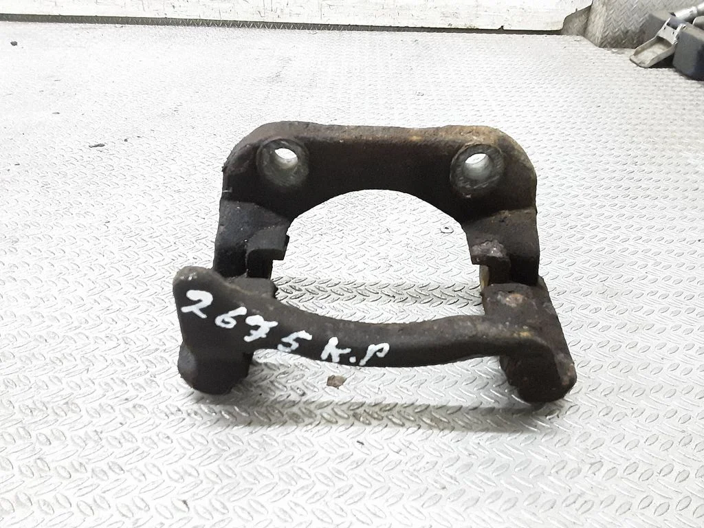 Front Brake Caliper Pad/Carrier – left