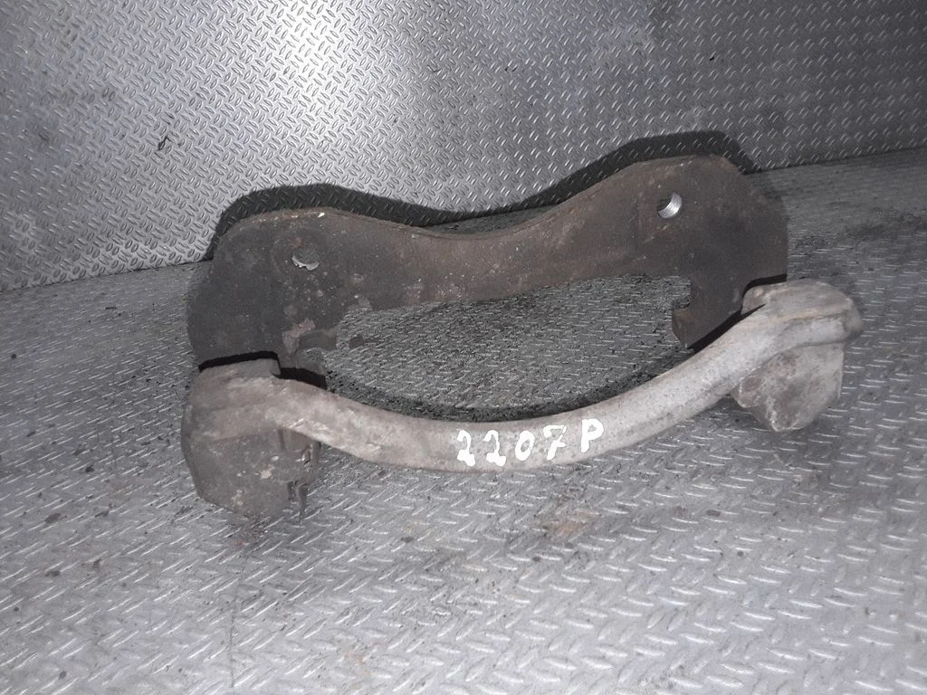 Front Brake Caliper Pad/Carrier – left
