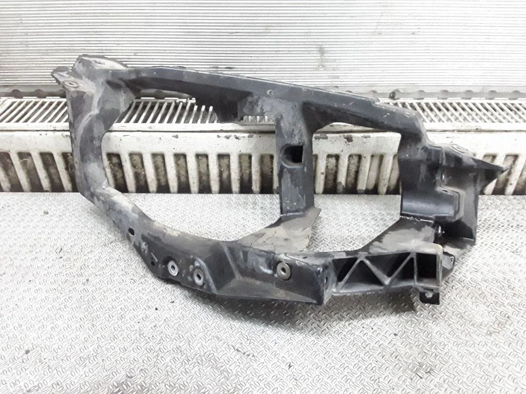 Headlight/headlamp mounting bracket – Mitsubishi Colt (1996-2004)