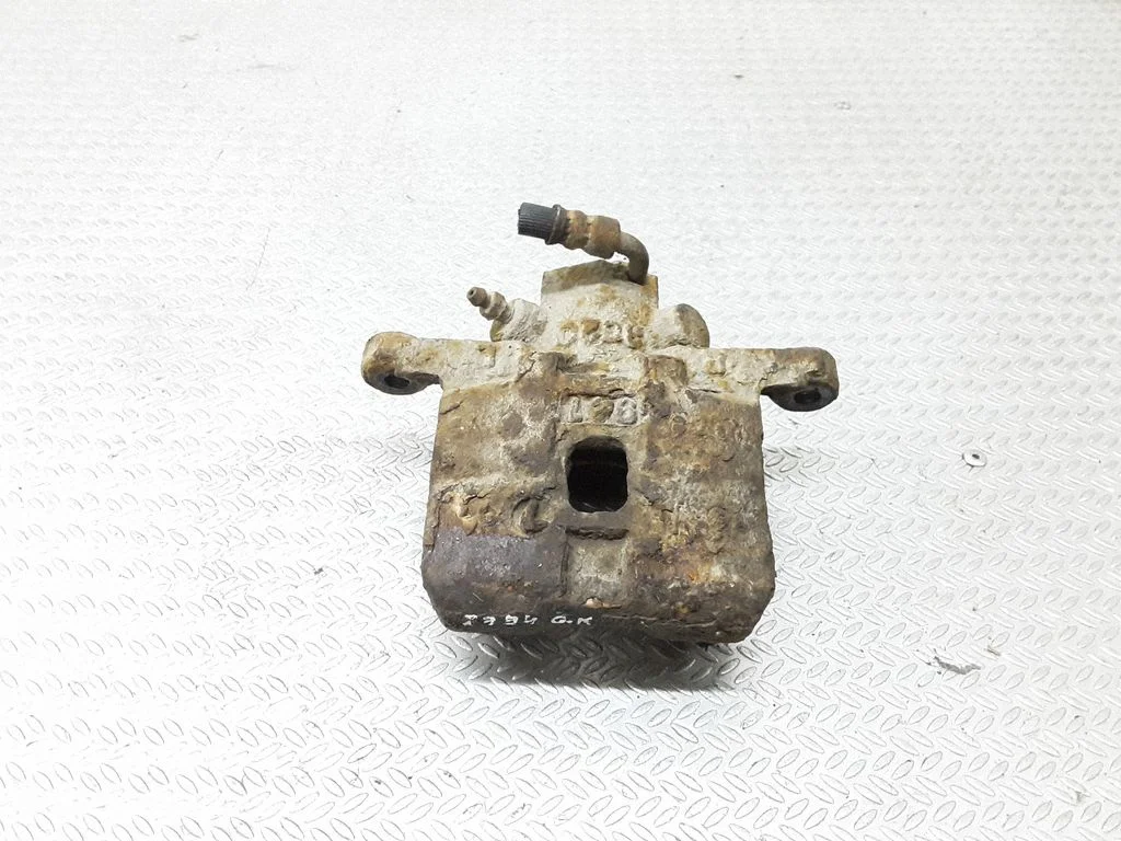 Rear brake caliper – left