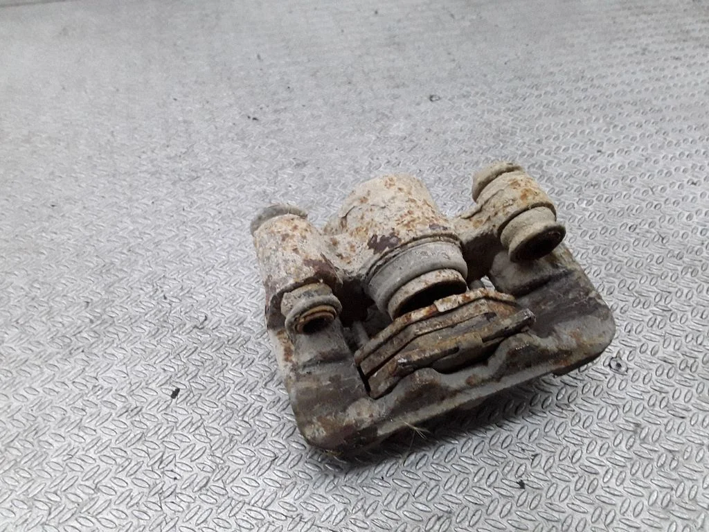 Rear brake caliper – left