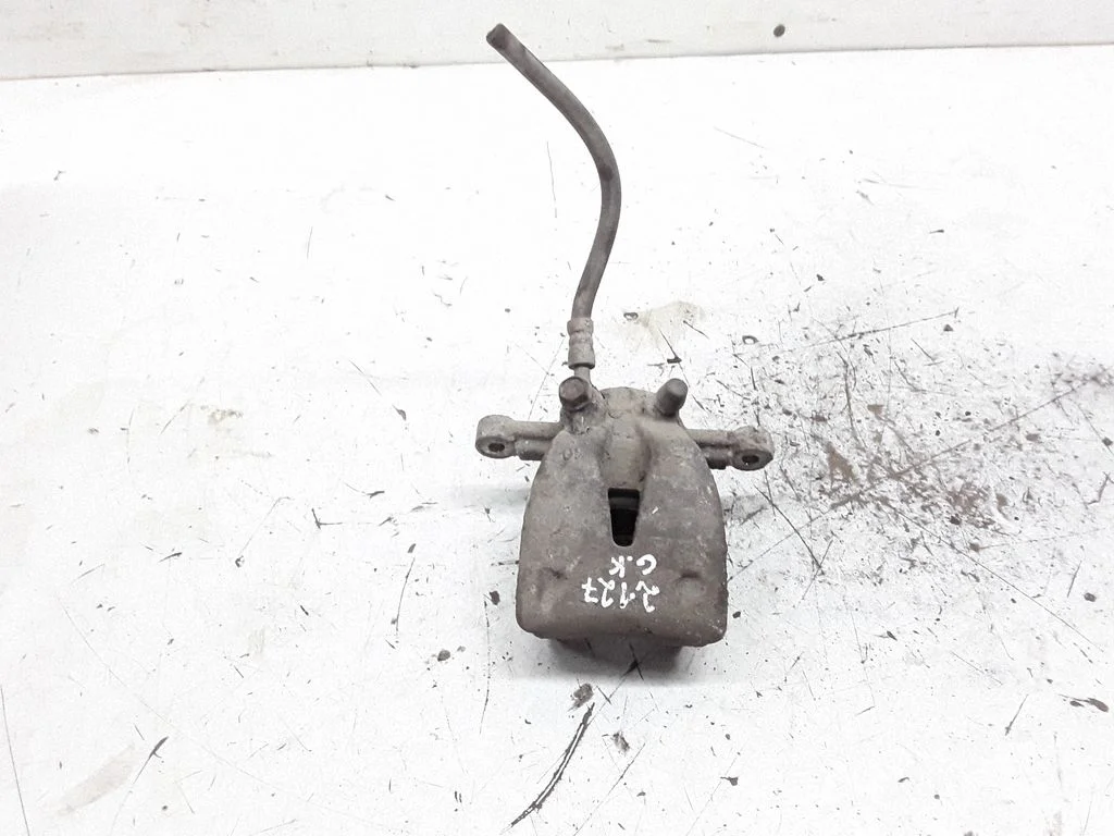 Rear brake caliper – left