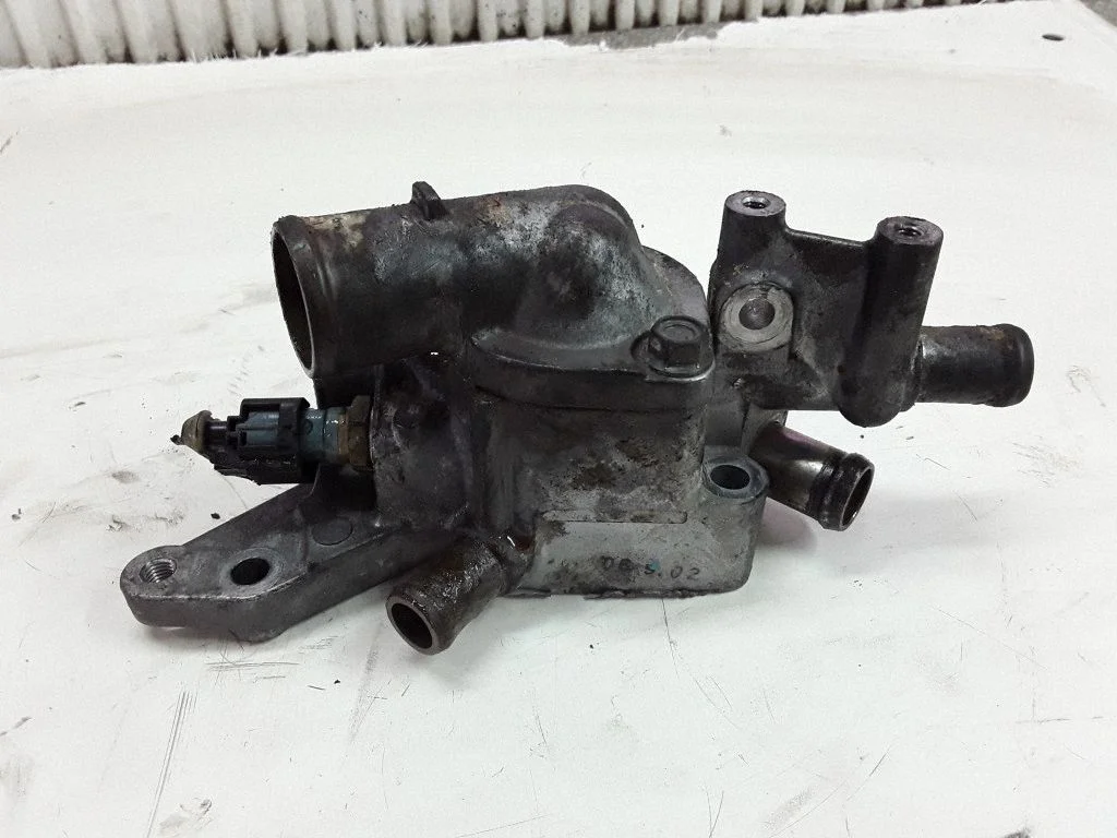 Thermostat/thermostat housing