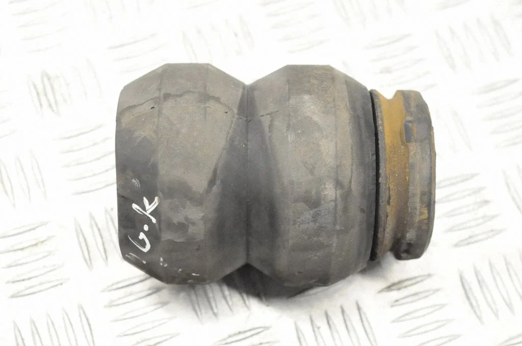 Rear coil spring rubber mount – rear left