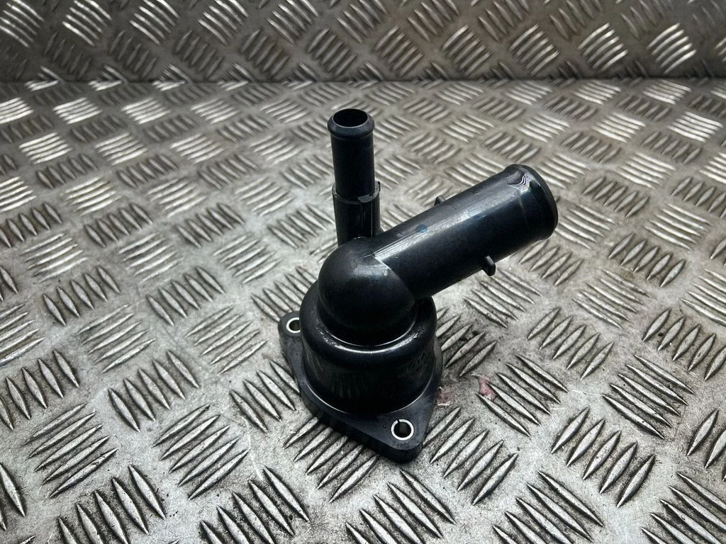 Thermostat/thermostat housing