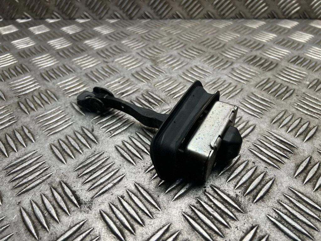 Rear door check strap stopper XFARL