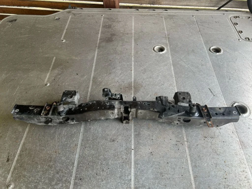 Top upper radiator support slam panel