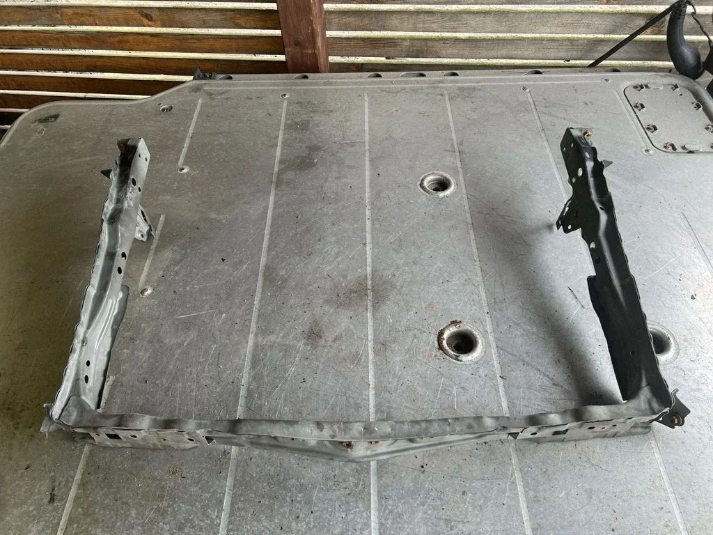 Bottom radiator support slam panel
