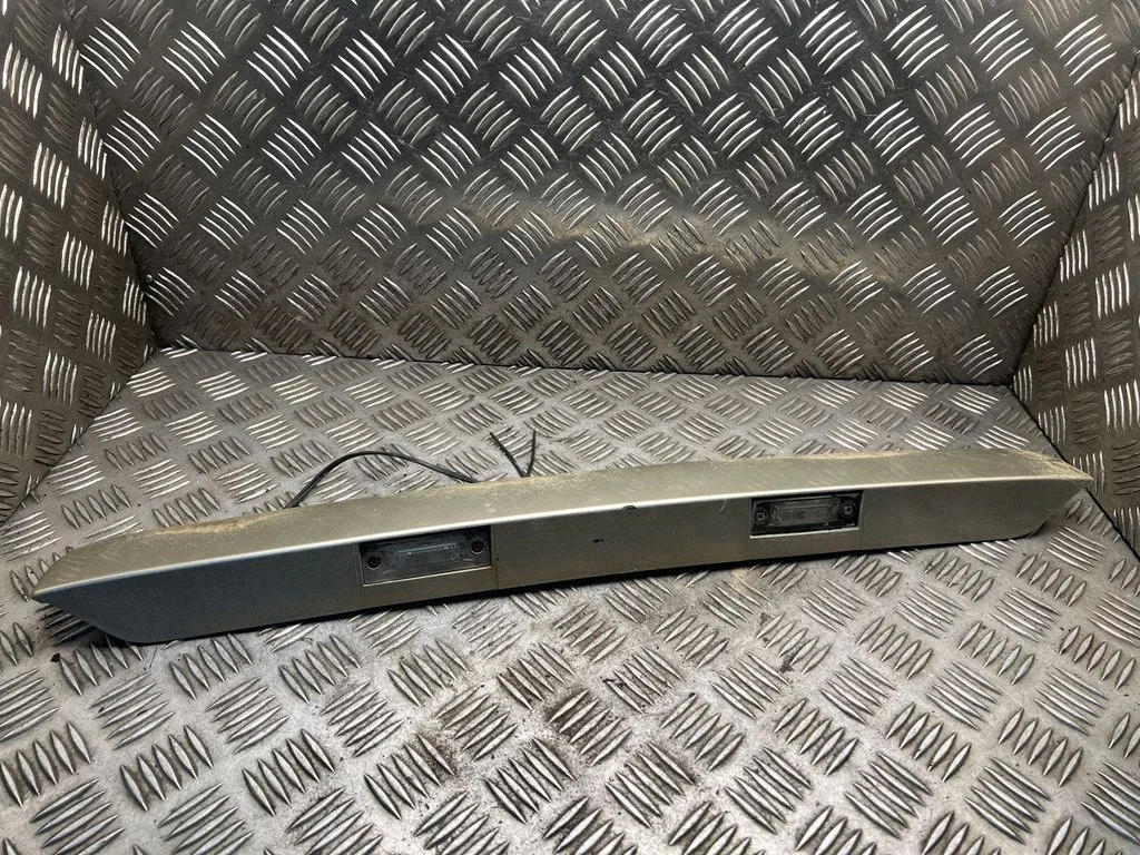 Trunk door license plate light bar 7E0827329F