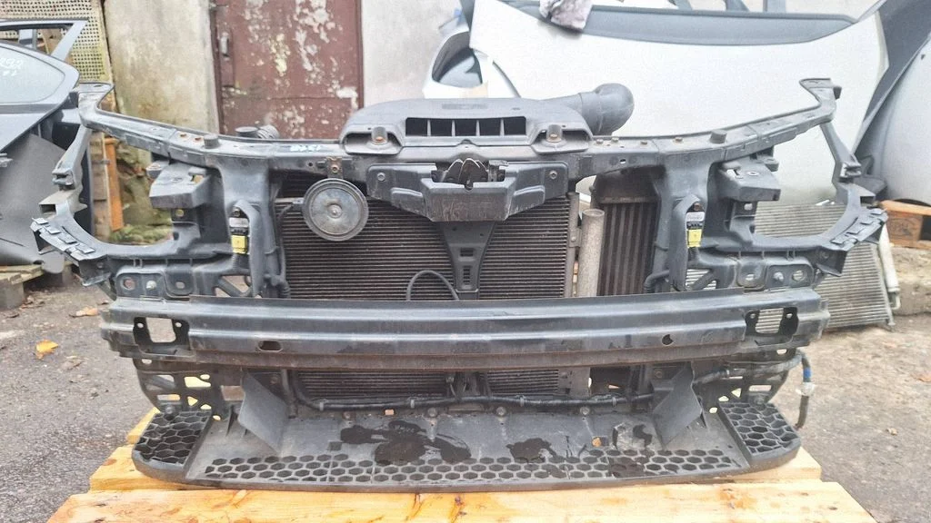 Radiator support slam panel