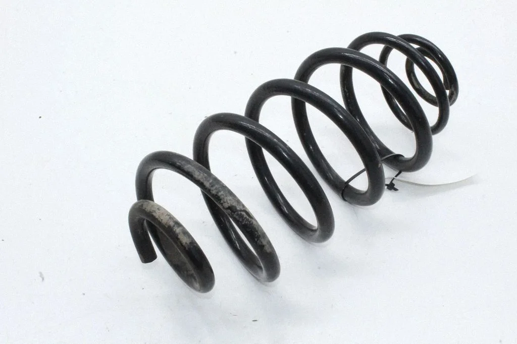 Rear coil spring – left