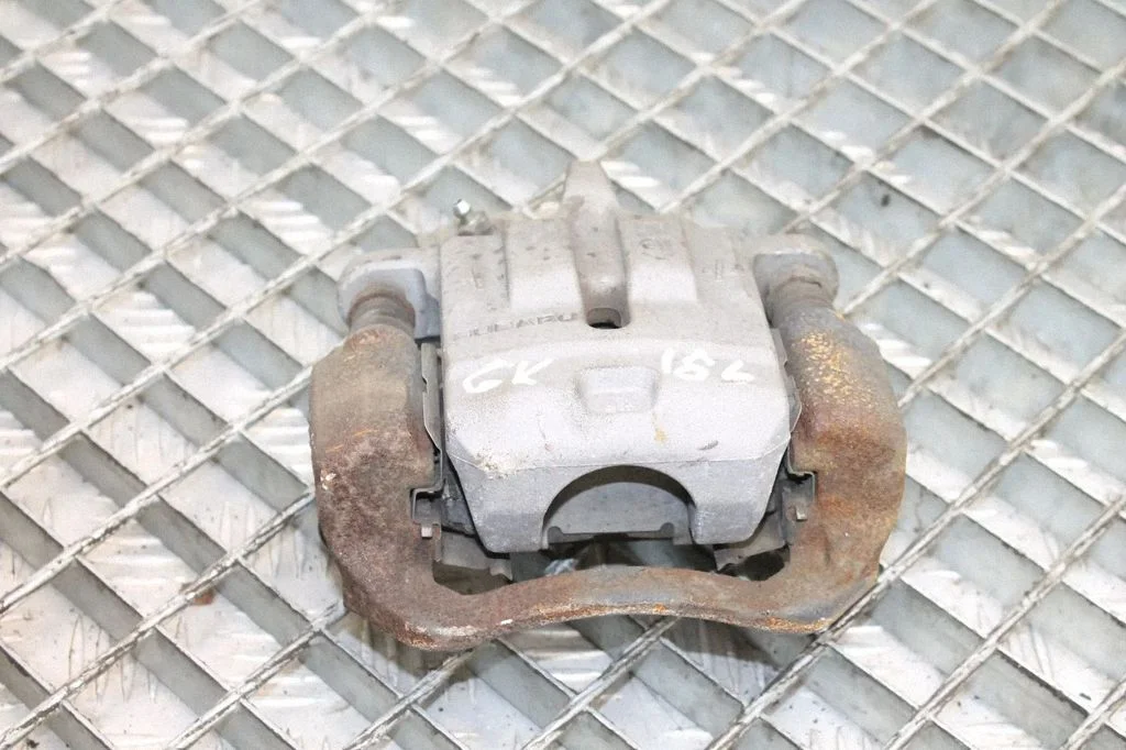 Rear brake caliper – left